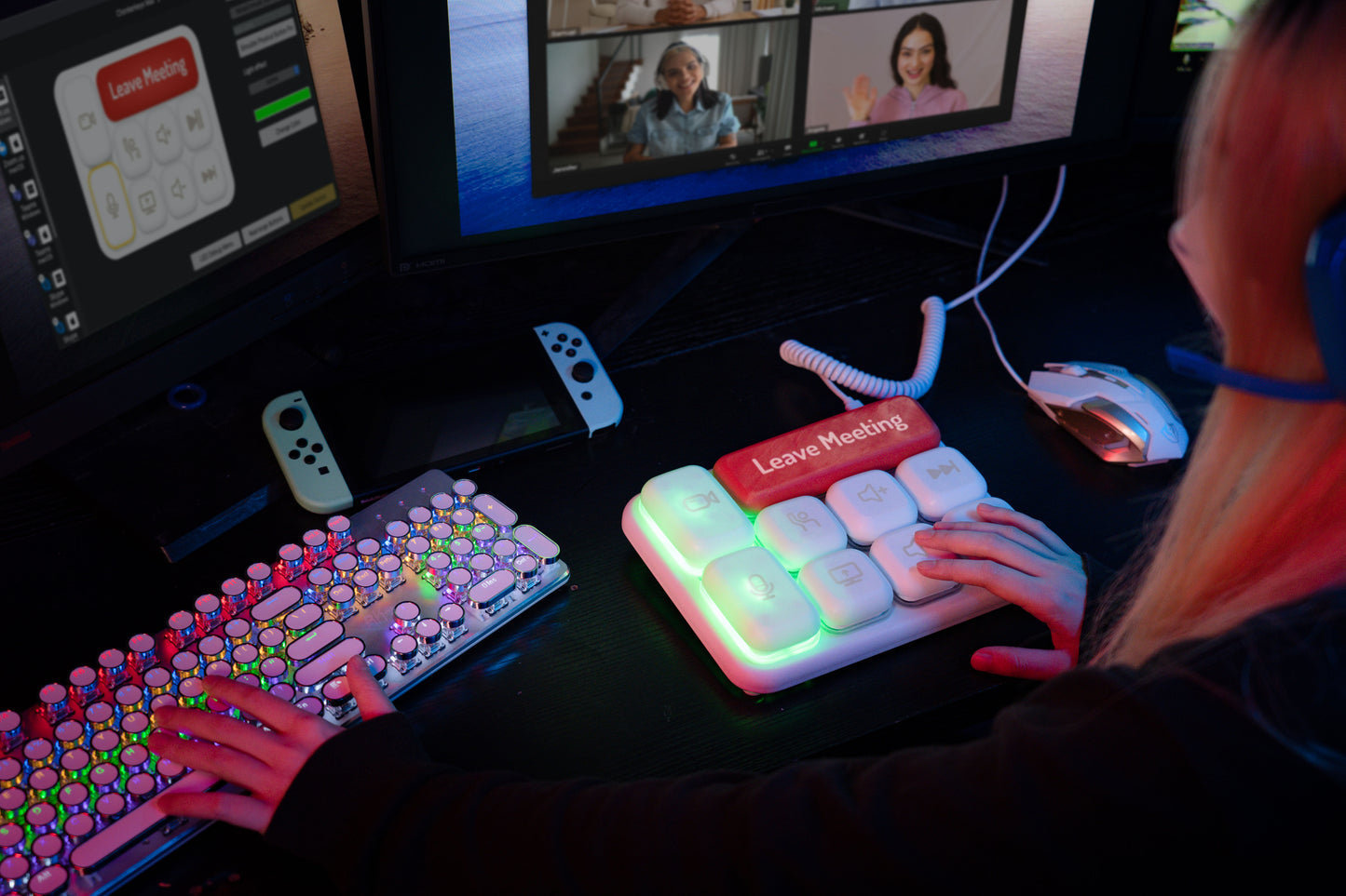 ChonkerKeys in a dark, colorful setting in front of two monitors.